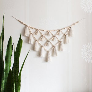 White tassel wall decor for baby nursery, Neutral boho wood bead garland, Hygge bedroom over the bed wall decor, Christmas wall hanging