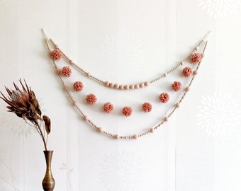 Peach pink pom pom garland for mantel. Easter felt ball & yarn pom wall hanging. Baby girl nursery bunting. Bedroom over the bed wall decor