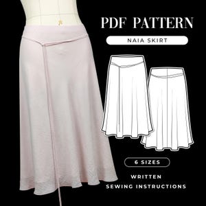 May include: A PDF pattern for a Naia skirt, featuring a light pink skirt with a thin waist tie on a dress form. The graphic includes technical line drawings of the front and back of the skirt, the text PDF PATTERN, NAIA SKIRT, 6 SIZES, and WRITTEN SEWING INSTRUCTIONS.