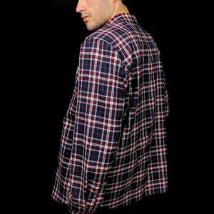 May include: A long-sleeved plaid shirt with a red, white and blue pattern. The shirt has a button-down collar and a relaxed fit.