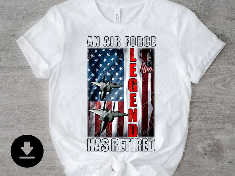 May include: White t-shirt featuring a red, white and blue American flag design. The text "An Air Force Legend Has Retired" is printed on the shirt. Two fighter jets are flying over the flag.