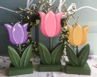 Wooden pastel spring tulips.  Hand painted set of three consists of one large and two smaller tulips.