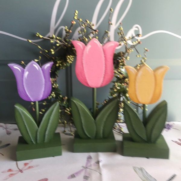 Wooden pastel spring tulips.  Hand painted set of three consists of one large and two smaller tulips.