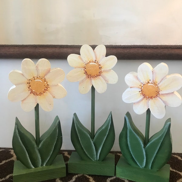 Wooden hand painted daisies. Just in time for spring decorating. Each daisy is painted on both sides. They are sold only in a set of three.