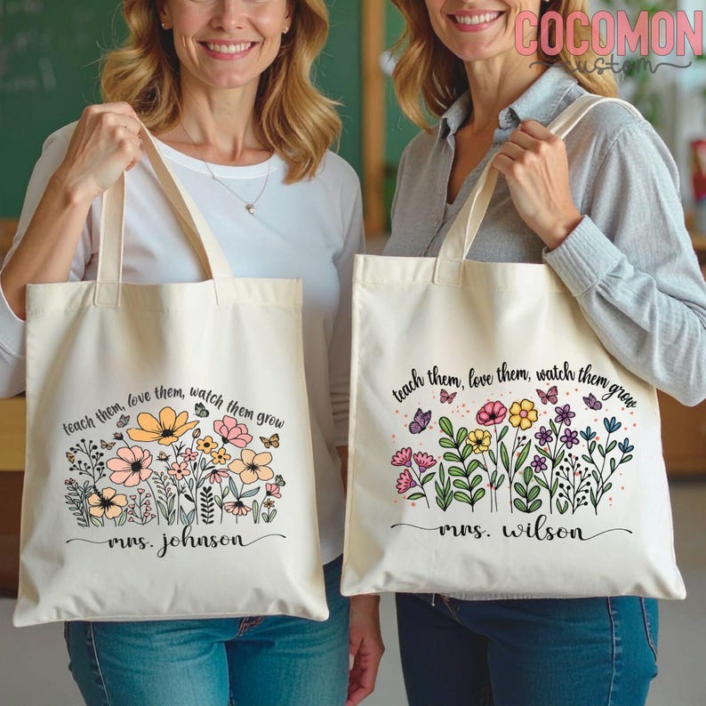May include: Two cream-colored tote bags with floral designs and the text "teach them, love them, watch them grow." One bag says "Mrs. Johnson" and the other says "Mrs. Wilson."
