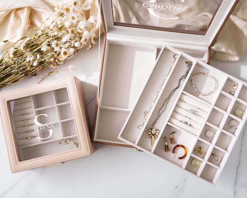 a couple of jewelry boxes sitting on top of a table