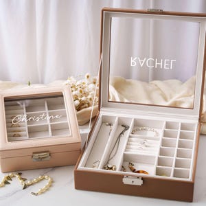an open jewelry box sitting on top of a table