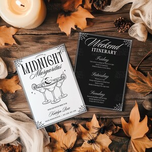 May include: Two Halloween-themed event cards with spiderweb borders. One card reads "Midnight Margaritas" with a cocktail illustration. The other is a black card with a "Weekend Itinerary". Autumn leaves and spiders decorate the wooden surface.