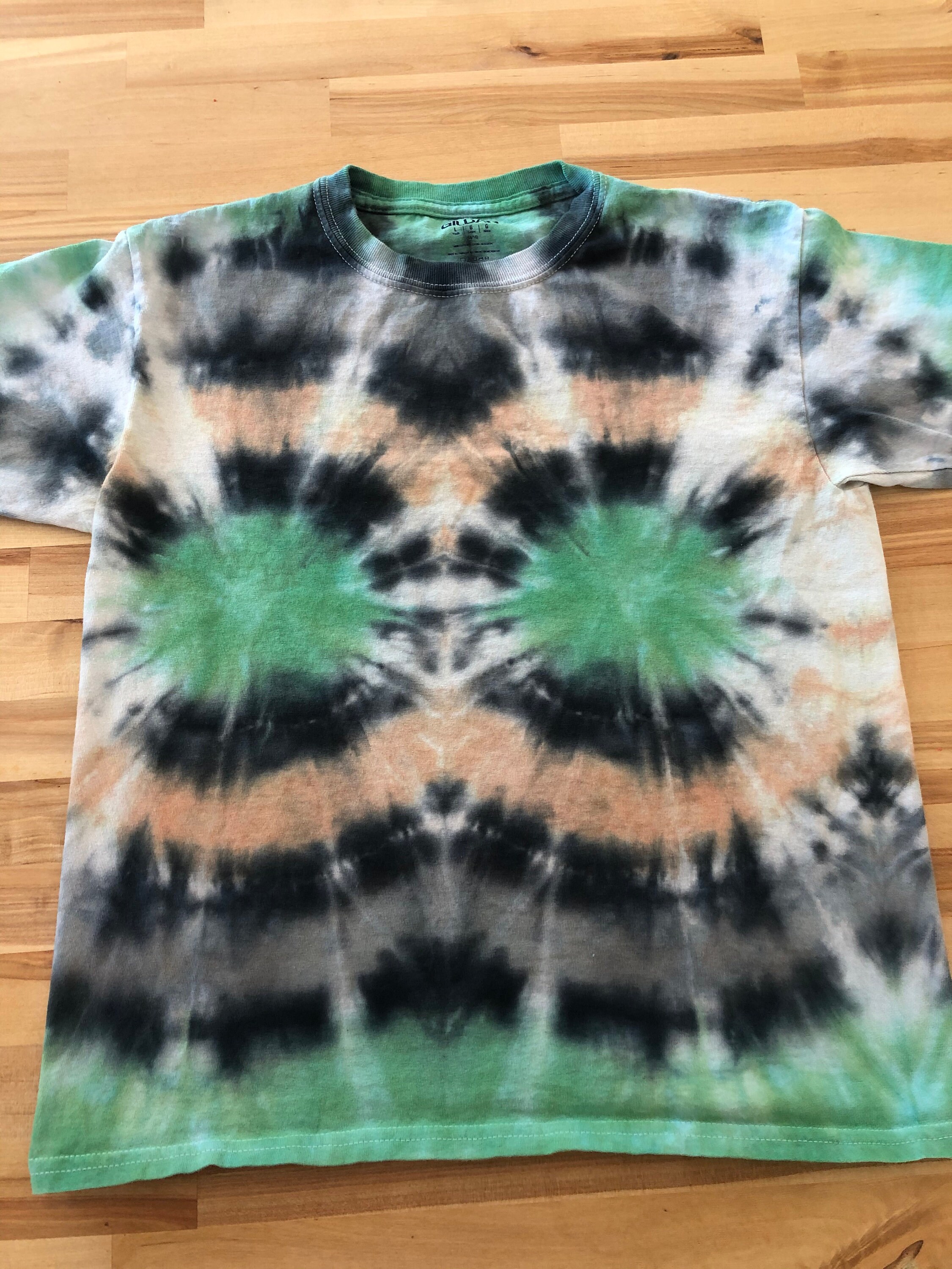 black tie dye on grey shirt