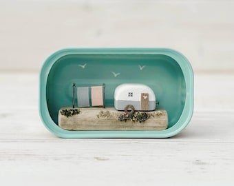 Sardine Tin Caravan. Driftwood scene.