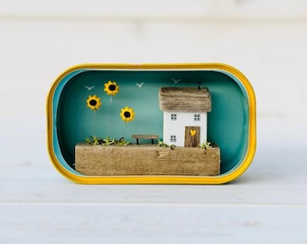 Sardine Tin Cottage. Driftwood scene.
