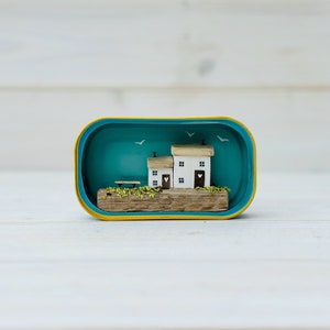 Sardine Tin Cottages. Driftwood scene.