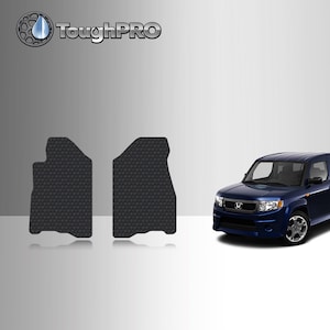 May include: Two black rubber floor mats for a car. The mats have a honeycomb pattern and are designed to protect the car's interior from dirt and spills. The mats are shown in front of a blue Honda Element.