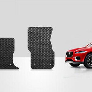May include: Black floor mats for a car with a diamond pattern. The mats are shown in front of a red SUV.