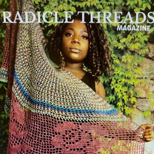 May include: A woman wearing a multi-colored crochet shawl with a floral design. The shawl is made with a variety of colors, including red, blue, green, and yellow. The woman is standing in front of a green leafy background. The text "Radicle Threads Magazine" is visible at the top of the image.