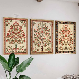 May include: Three framed prints of stylized floral trees with red flowers and green leaves. The frames are gold, black, and white.
