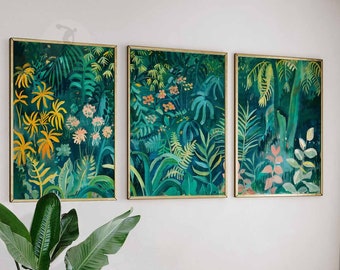 May include: Three framed prints of a tropical jungle scene with lush green foliage, vibrant yellow flowers, and pink flowers. The prints are arranged in a row on a white wall.