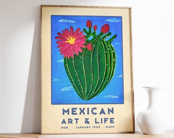 May include: A framed poster with a blue background featuring a green cactus with a pink flower. The text on the poster reads "Mexican Art & Life No. 5 January 1939 D.App."