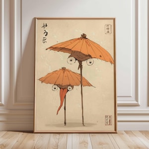 Puede incluir: Impresión artística enmarcada que presenta dos criaturas caprichosas con forma de paraguas, con ojos grandes y expresivos y largas y delgadas piernas. Los paraguas son de color naranja y la obra de arte tiene texto japonés y una estética vintage.