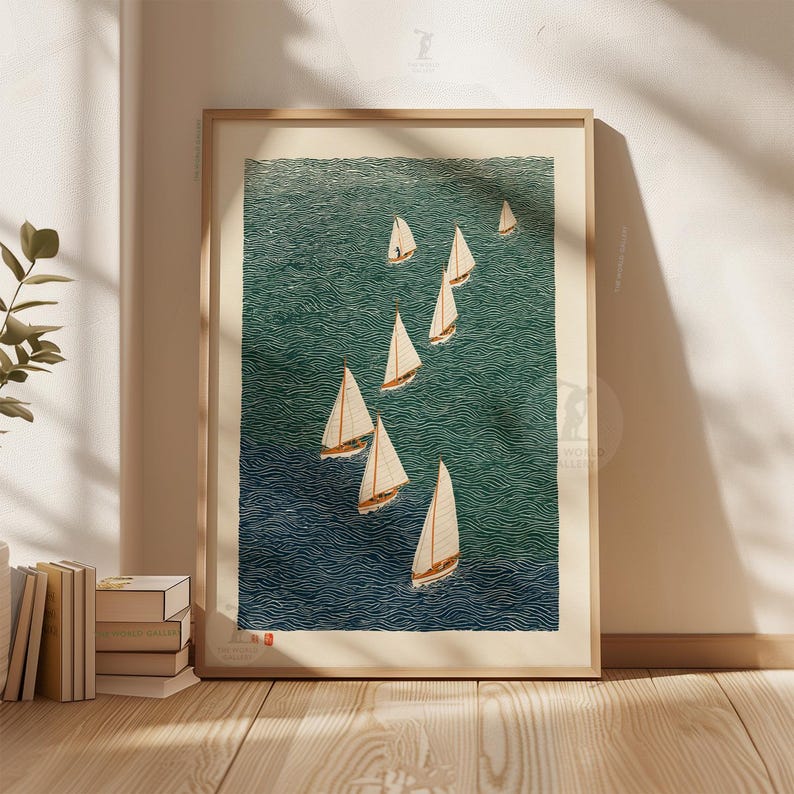 May include: A framed print featuring a fleet of sailboats on a textured teal and navy blue ocean. The sailboats have white sails and brown hulls. The artwork is displayed in a light wood frame.