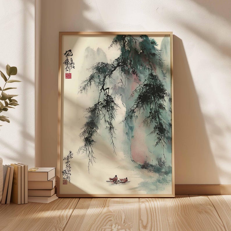 Puede incluir: Pintura de acuarela enmarcada que representa un sereno paisaje monta&ntilde;oso con un &aacute;rbol llor&oacute;n. La obra presenta suaves azules, verdes y rosas, con dos peque&ntilde;os p&aacute;jaros en primer plano. El marco es de color madera clara.