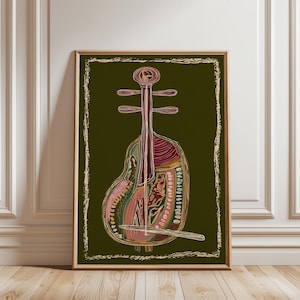 May include: A framed print depicting a stringed instrument, possibly a lute, with a detailed, colourful illustration. The artwork uses shades of red, pink, green, and gold against a dark olive-green background. The frame is a warm brown.
