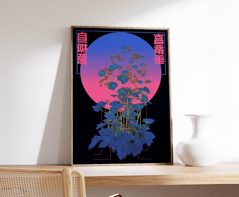 May include: A framed art print featuring a stylized botanical illustration. The artwork showcases blue and teal foliage against a gradient background of pink and blue, with Japanese text on the sides. A white vase sits on a wooden surface.