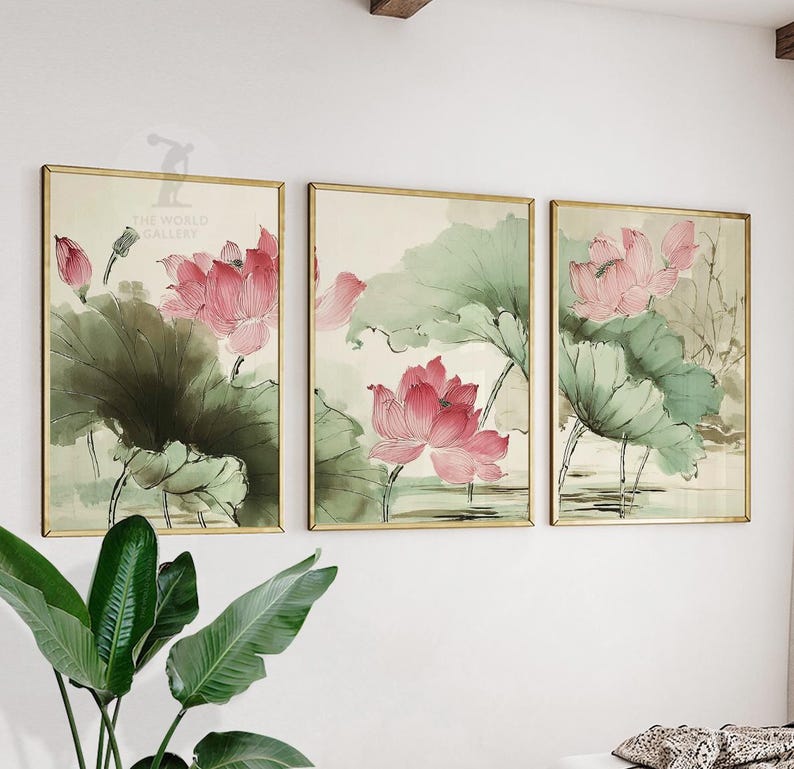 May include: Three framed art prints featuring watercolor paintings of pink lotus flowers and green lily pads. The artwork has a gold frame and a neutral background. The style is reminiscent of traditional Asian art.