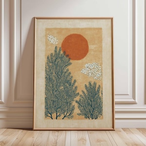 May include: Framed art print featuring a stylized landscape. The artwork depicts a large orange sun, white cloud-like shapes, and dark teal-colored trees against a tan background. The print is encased in a wooden frame.