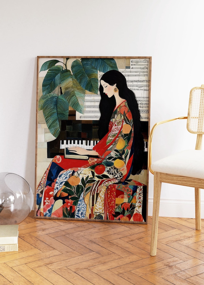 May include: A framed art print showing a woman playing a piano. She is dressed in a colourful patterned dress with fruit and floral designs. The artwork includes a piano, sheet music, and a large green plant. The background is a collage of textures and patterns.