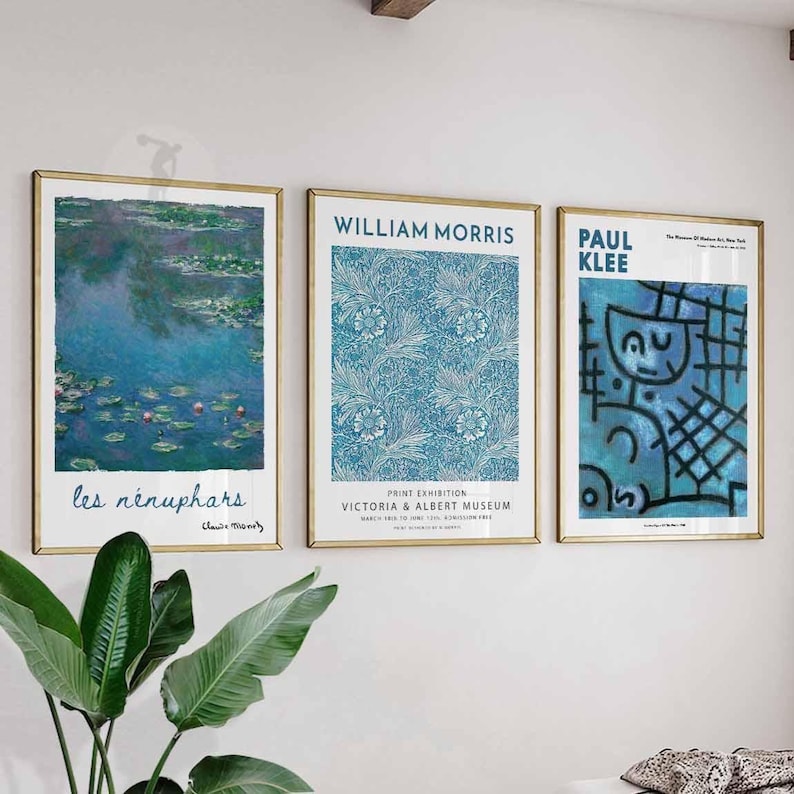 May include: Three framed art prints with gold frames. The prints feature artwork by Claude Monet, William Morris, and Paul Klee. The Monet print depicts water lilies, the Morris print has a floral pattern, and the Klee print has abstract figures.