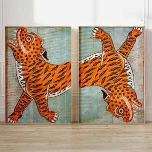 May include: Two orange and black tigers with white stripes are depicted in a vintage style painting. The tigers are facing opposite directions, with one tiger looking up and the other looking down. The background is a light blue color.