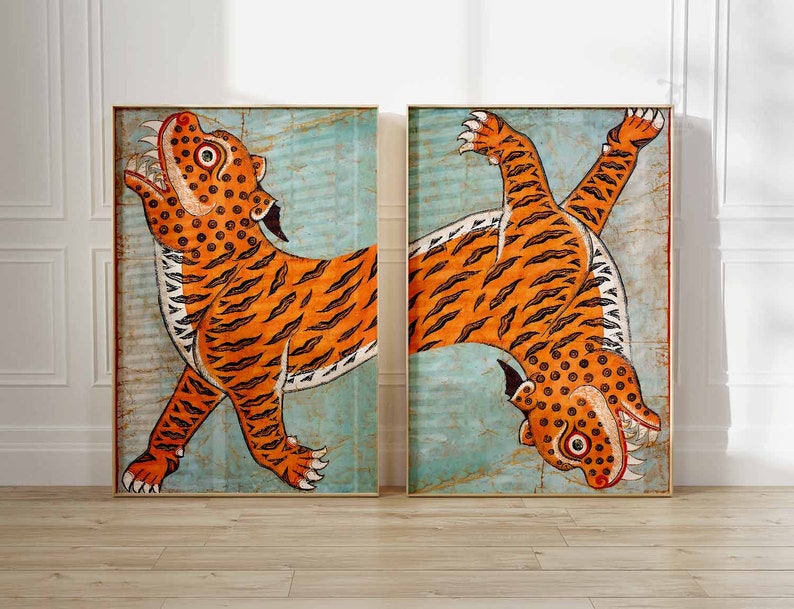 May include: Two orange and black tigers with white stripes are depicted in a vintage style painting. The tigers are facing opposite directions, with one tiger looking up and the other looking down. The background is a light blue color.