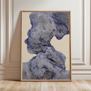 May include: Abstract art print with a blue and white striped design forming a human profile. The artwork is framed in a light brown wooden frame and set against a cream background. The art piece is displayed on a wooden floor.