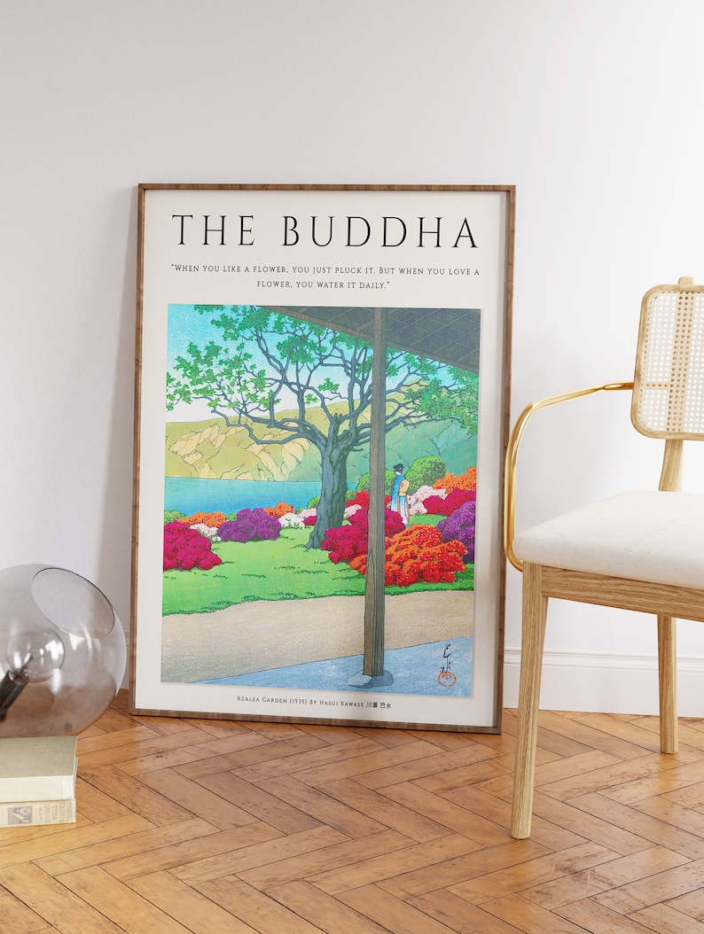 May include: A framed print of a Japanese woodblock print depicting a garden with a quote by the Buddha. The quote reads "When you like a flower, you just pluck it. But when you love a flower, you water it daily." The print is titled "Azalea Garden (1931) by Hakuju Kawai".