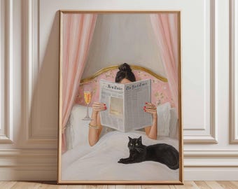 May include: A framed print showing a person reading "The New York Times" in bed, accompanied by a glass of champagne and a black cat. The bedroom setting features pink drapes and a gold headboard. The person's nails are painted red.