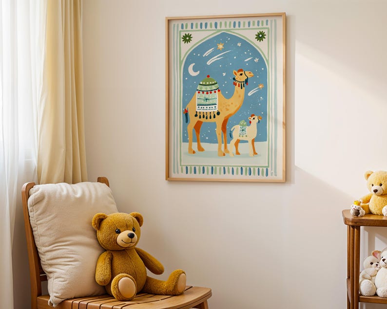 May include: A framed art print featuring a camel and a baby camel under a starry night sky. The artwork has a light blue background with a decorative arch and a wooden frame. The print is hanging on a white wall.