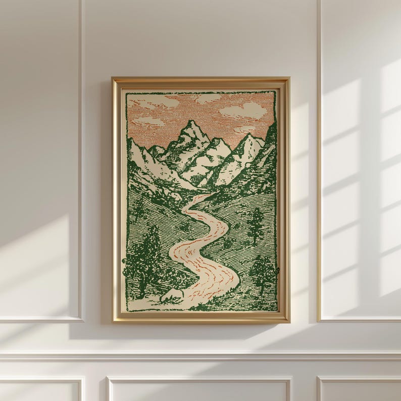 May include: A framed art print featuring a mountain landscape with a winding river. The artwork is in green and red tones, with a beige background and a gold frame. The print depicts mountains, trees, and a river.