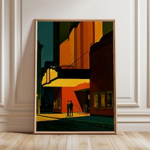 Puede incluir: Una lámina artística enmarcada que representa la entrada de un teatro de noche con dos figuras bajo una marquesina amarilla brillante. El edificio presenta paredes de color naranja y rojo intenso, sombras oscuras y una barrera de cuerda roja.