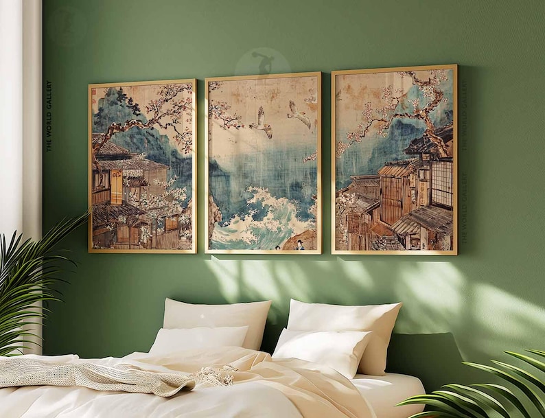 May include: Three framed prints of Japanese-style artwork depicting buildings, trees, and water. The prints are in a gold frame and have a vintage aesthetic.