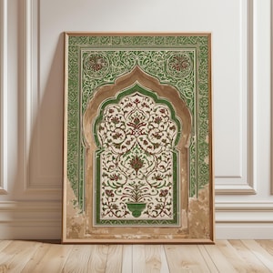 May include: Framed art print with an arched design, showcasing green and red floral patterns on a cream backdrop. The light brown frame complements the artwork, displayed against a white wall and wooden floor.