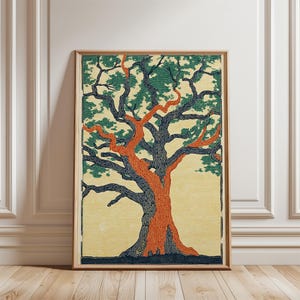 May include: A framed art print featuring a stylized tree illustration. The tree has a vibrant orange trunk and branches, with dark blue and green foliage. The background is a soft yellow, and the frame is a natural wood color.