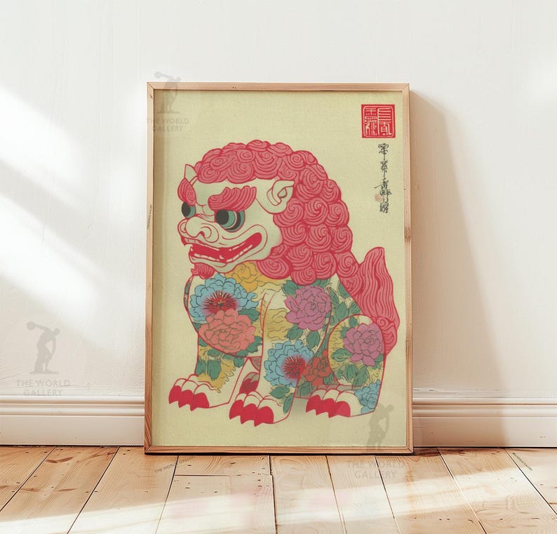May include: Framed print of a stylized lion-like creature with a red mane and floral patterns. The artwork features a cream background and is displayed in a wooden frame. The lion has a fierce expression and is adorned with colorful flowers.
