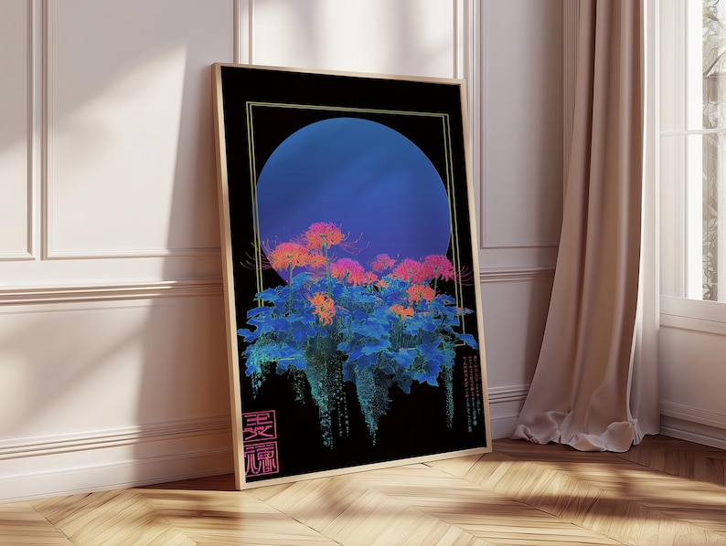 May include: Framed art print featuring a stylized floral design. The artwork showcases a large blue circle against a black background, with vibrant orange and blue flowers. The print is in a gold frame and leans against a wall.