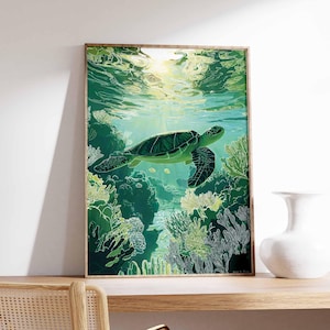 May include: A framed art print featuring a green sea turtle swimming underwater. The artwork depicts the turtle amidst coral reefs in shades of green and white, with sunlight filtering through the water. The frame is a natural wood color.