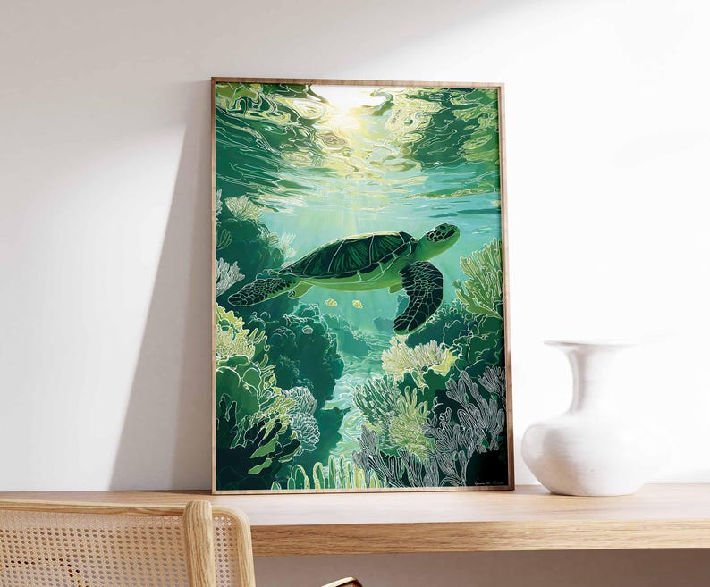 May include: A framed art print featuring a green sea turtle swimming underwater. The artwork depicts the turtle amidst coral reefs in shades of green and white, with sunlight filtering through the water. The frame is a natural wood color.