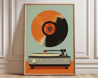May include: A framed art print featuring a retro-style illustration of a record player with a vinyl record. The record is orange and black with a flower in the center. The record player is gray and black, set against a light blue and orange background.