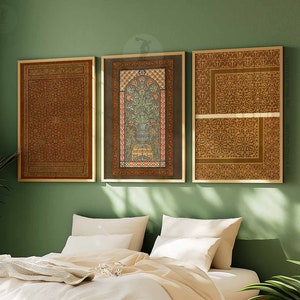 May include: Three framed prints with intricate geometric patterns in shades of brown and gold. The prints are hung on a green wall above a bed with white bedding.