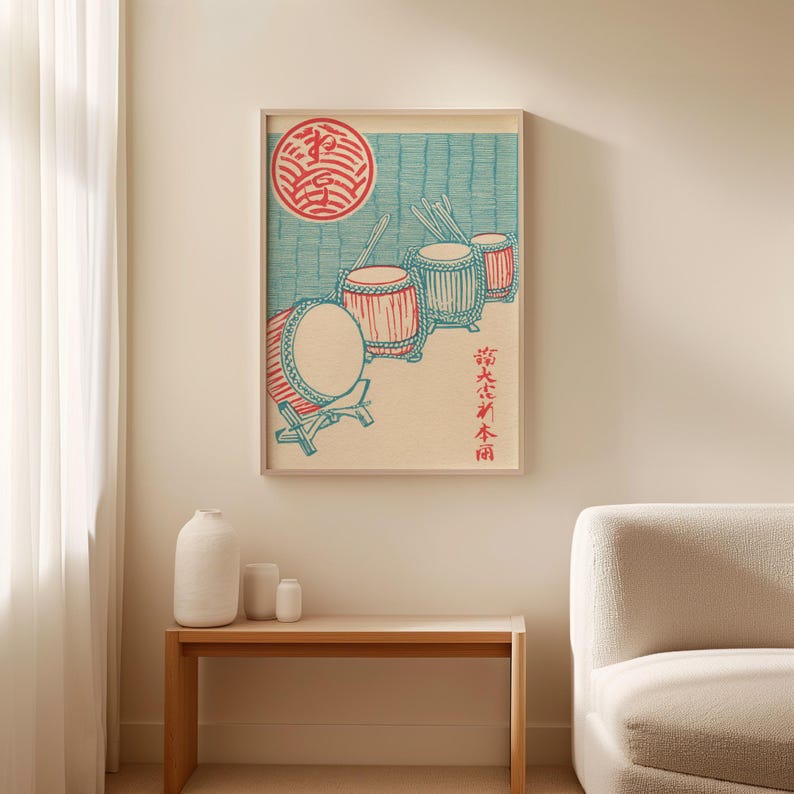 May include: Framed print featuring a Japanese woodblock print style illustration of taiko drums. The artwork uses red, blue, and beige tones. The print includes a red circle and Japanese text.