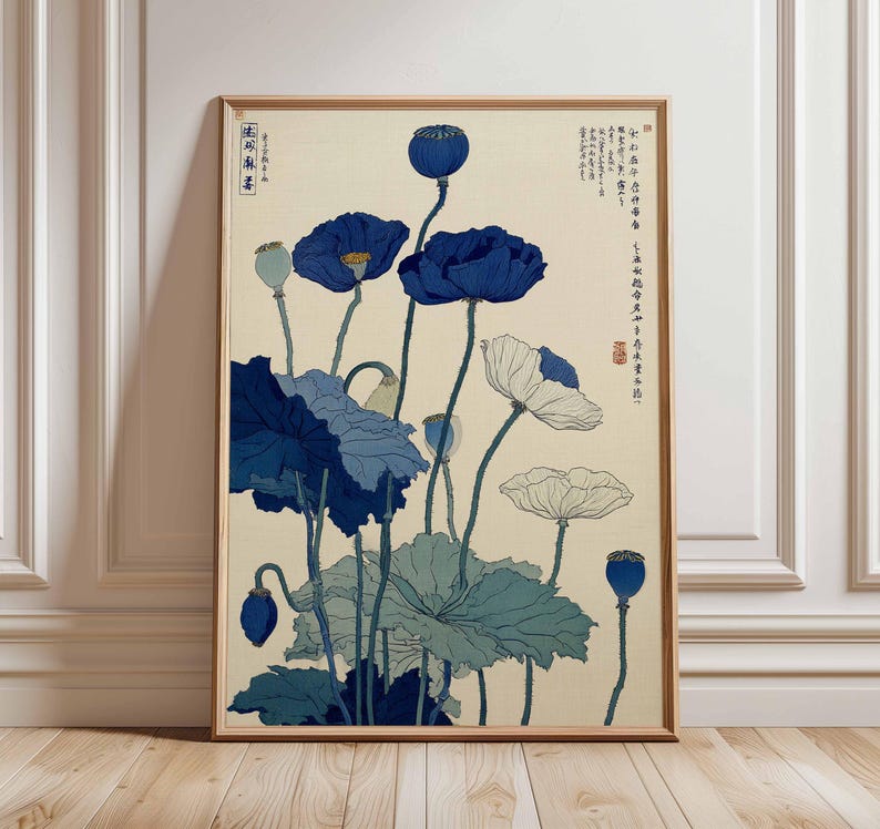 May include: Framed art print featuring a botanical illustration of blue and white poppies. The artwork has a vintage aesthetic, with detailed depictions of the flowers and leaves. The print is in a wooden frame, adding to its classic appeal.